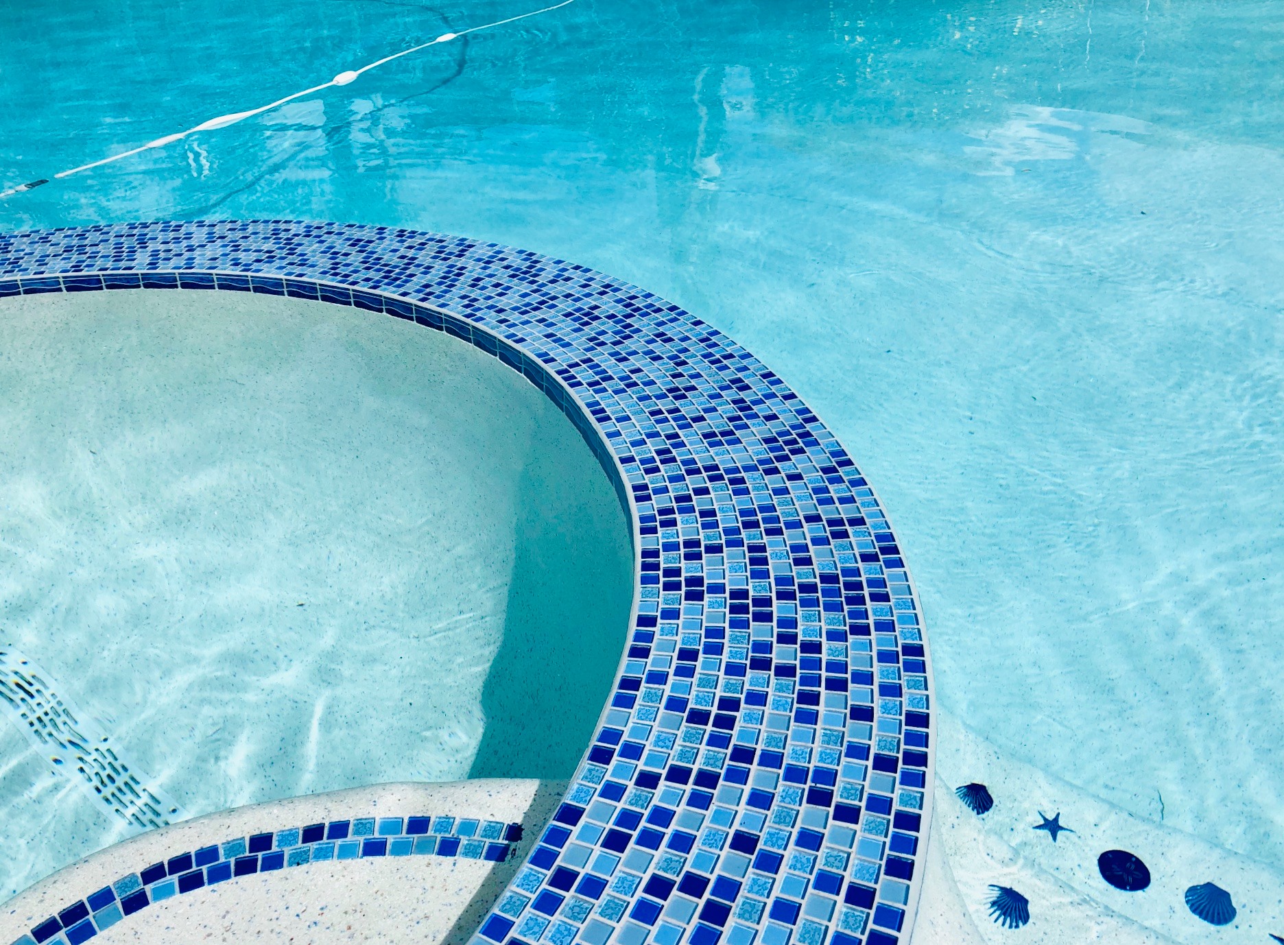 Cobalt blue mosaic tile spa at a Desert Shores Las Vegas luxury home